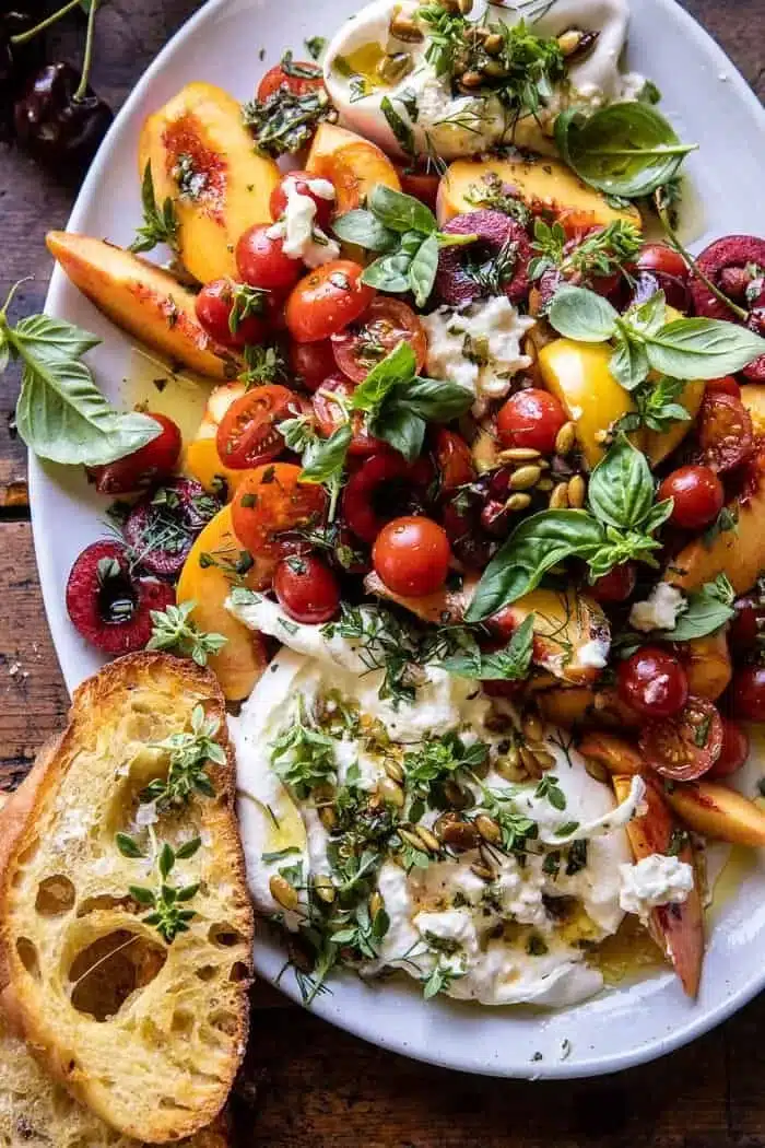 Tomato, Peach, and Burrata Salad. 1 Fresh Tomato Peach Burrata Salad with vibrant ingredients and creamy cheese